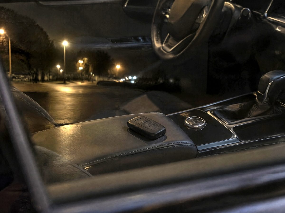 A key fob on the console of a locked car